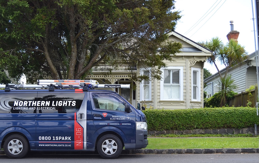 Northern Lights Van outside an Auckland Villa for a rewiring job